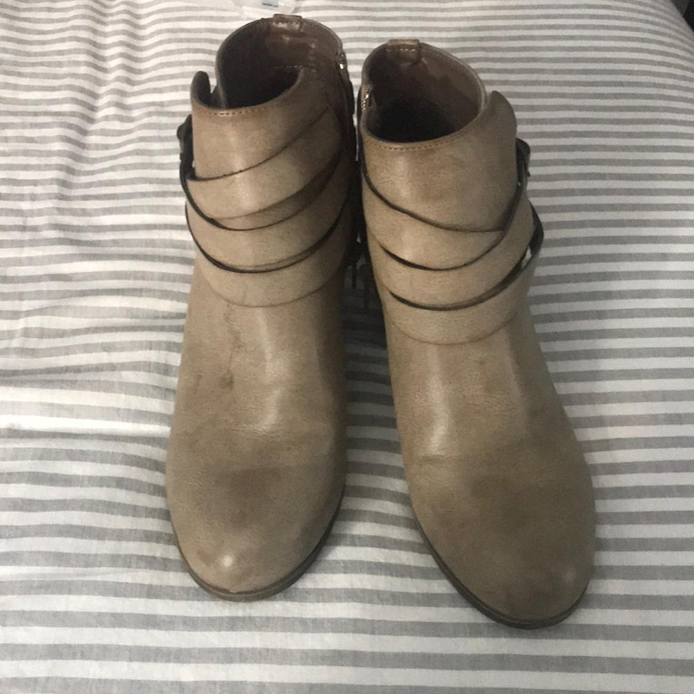 Taupe ankle high heeled booties.